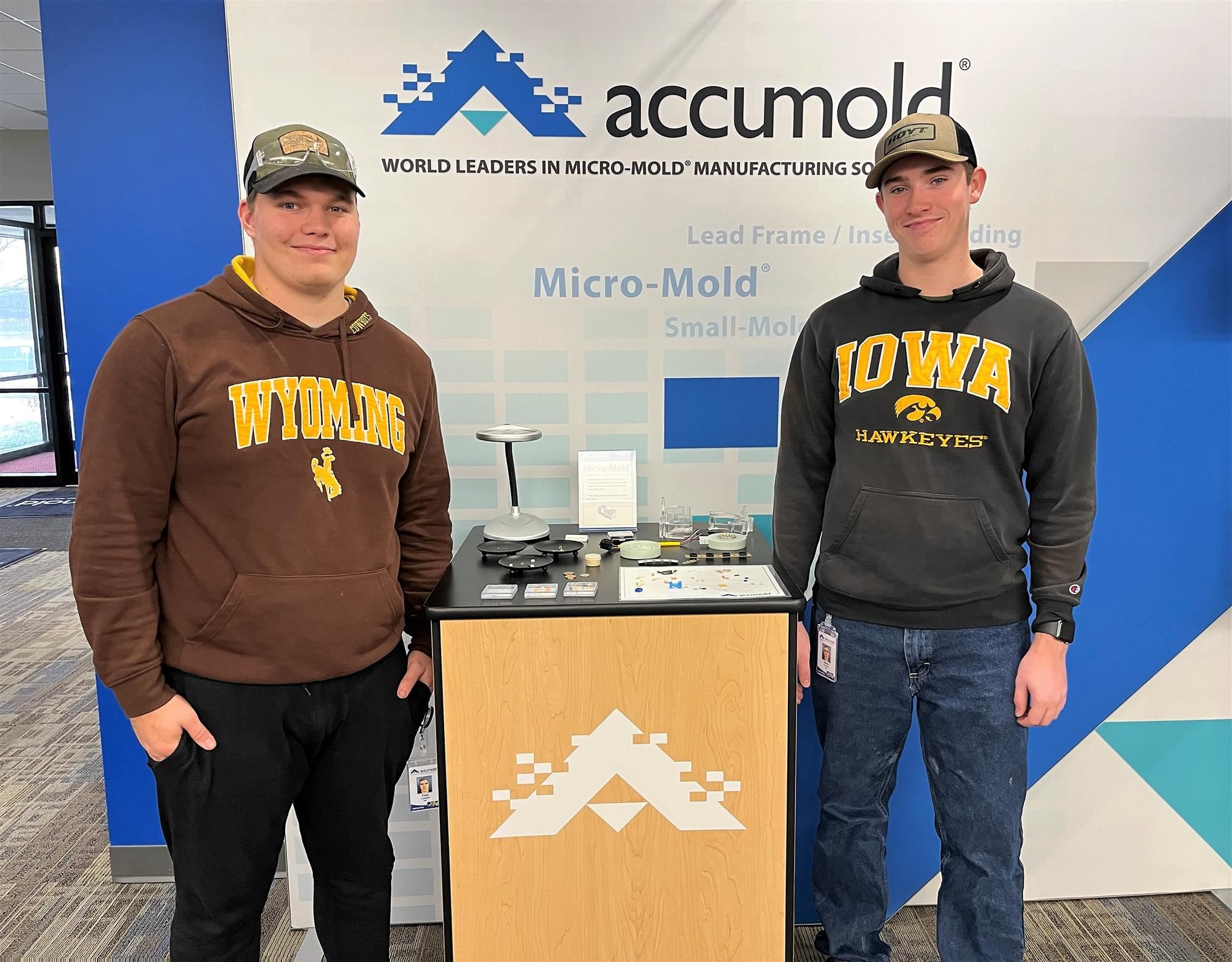 two students pictured onsite at Accumold