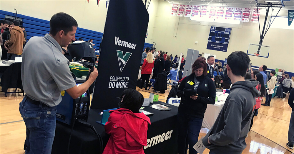 Students learning from local business at career fair