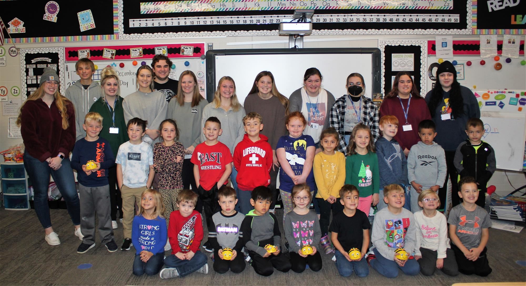 Group picture of academy students and kindergarteners